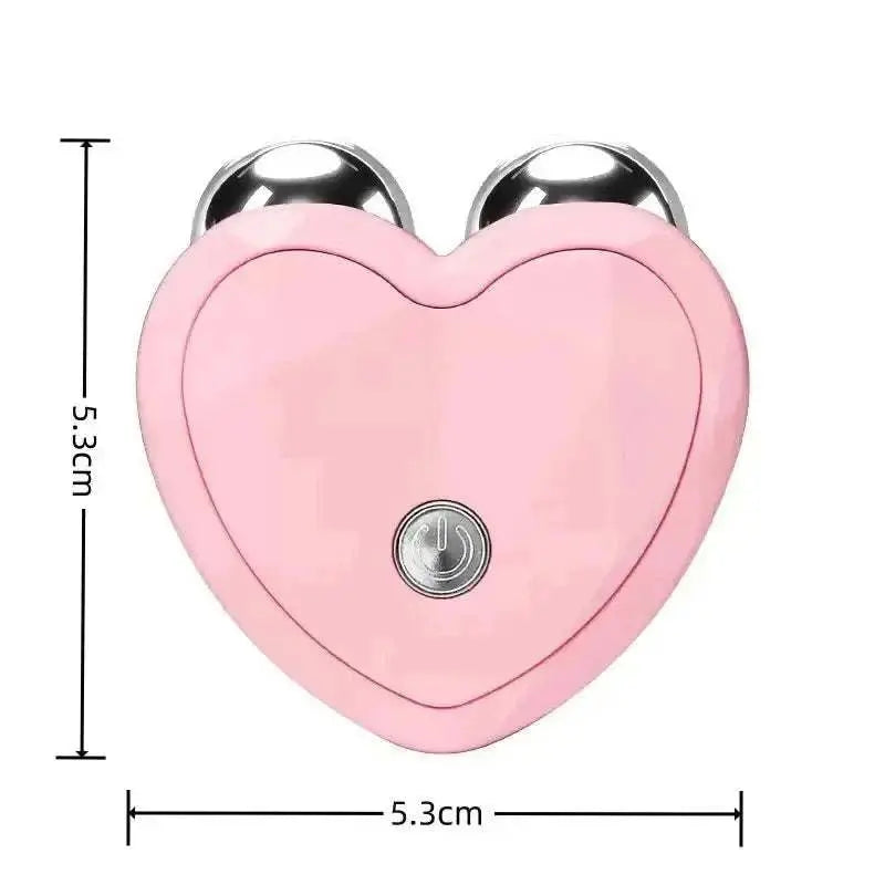 Pink heart-shaped microcurrent face lifting massager with dual metal spheres and power button, compact and ergonomic design.