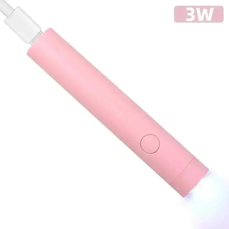 Mini USB Nail Dryer Lamp in pink, compact and portable LED gel curing tool for salon-quality manicures.