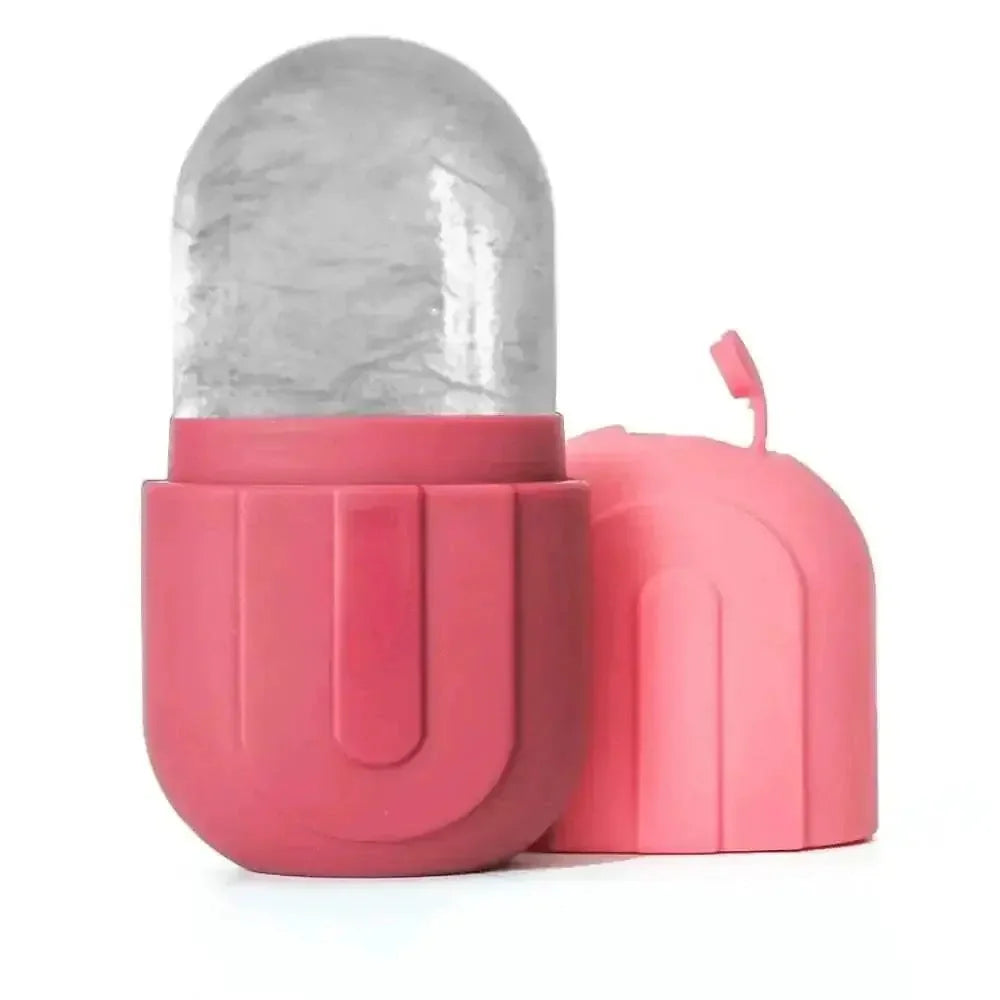 Pink silicone ice roller with clear frozen gel top and matching cap for facial cooling and skin care