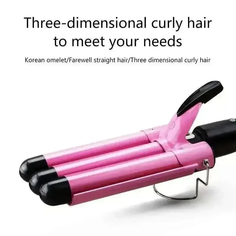 Pink triple barrel hair waver with ceramic barrels for creating beach waves and curly hair styles