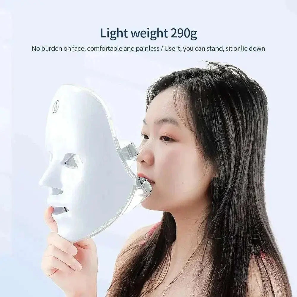 Woman holding a lightweight Wireless LED Light Therapy Mask designed for face and neck skincare treatment
