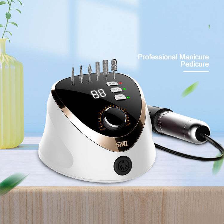 High speed nail removal device on wooden surface for professional manicure and pedicure at home.