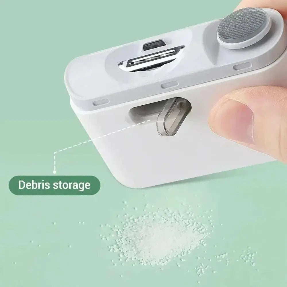 Close-up of Electric USB Nail Trimmer with light showing debris storage compartment and ergonomic design.